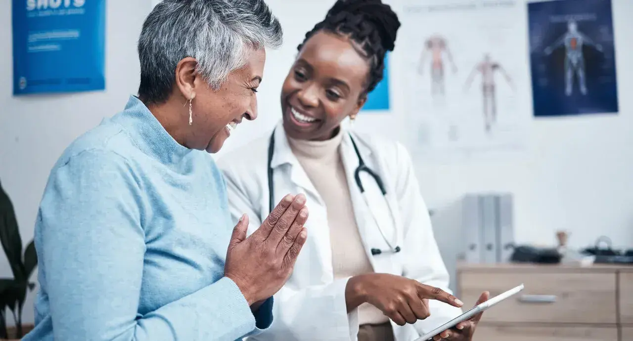 A clinician sharing good news with a patient
