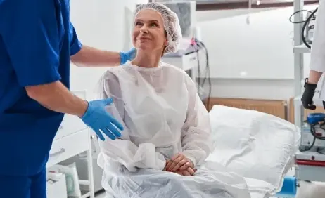 A nurse with a patient preparing for an endoscopy
