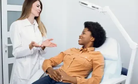 A clinician in consultation with a patient